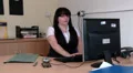 Woman at work puts hands behind head and stretches HD Footage