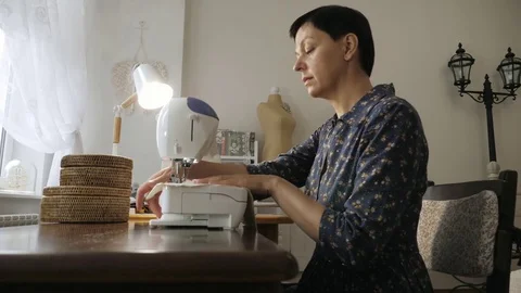 Woman at work on a sewing machine. Stock Footage 81583361