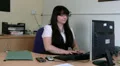 Woman at work, sitting at desk typing HD Footage