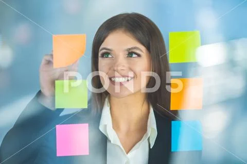 The woman work with stickers Stock Photos