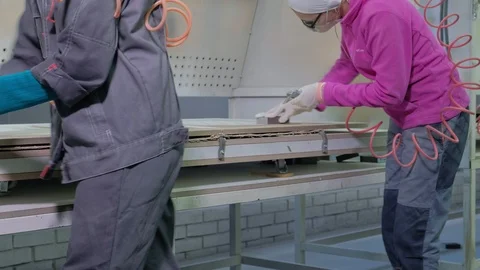 Woman, the worker makes the effect of aging doors. production of interior doors Video stock 98069545
