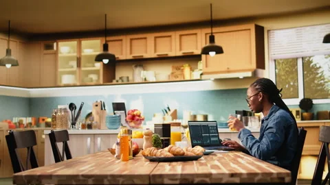 Woman worker takes analytics notes and manages projects on laptop Stock Footage 344244366