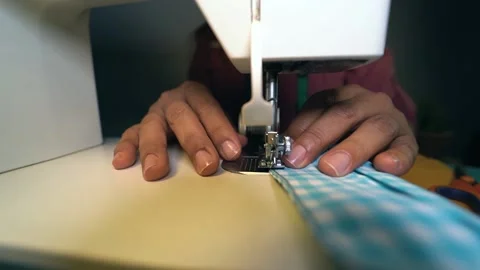 Woman worker using sewing machine while making face masks Stock Footage 145434009