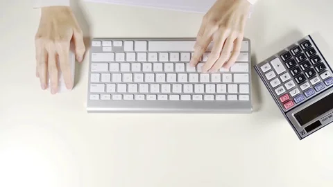 Woman worker working on computer and wireless mouse in the office Stock Footage 78996212