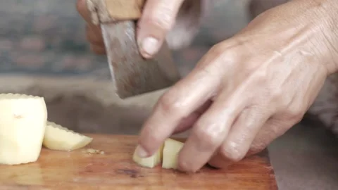 Woman workers slice potatoes to make spicy French fries. Close up view. Stock Footage 272715501