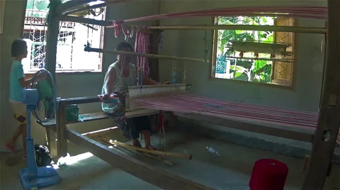 Woman working on ancient weaving machine. Stock Footage 48715313