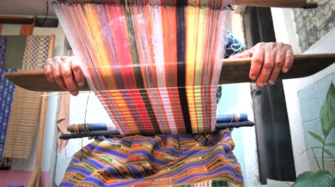 Woman working on backstrap loom Stock Footage 66458071