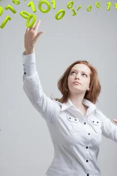 Woman working with binary code, concept of digital technology Stock Photos