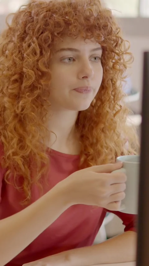 Woman working with computer and smiling in a coworking Video stock 264390948