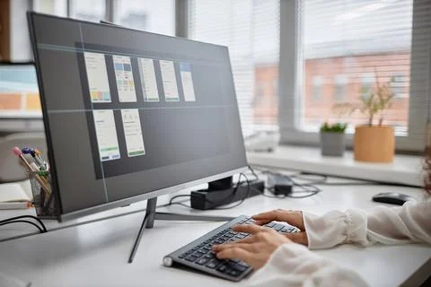 Woman Working on Computer Developing Mobile Application Foto stock