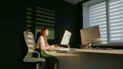 Woman working on computer in empty office. Working overtime Stock Footage 172258280