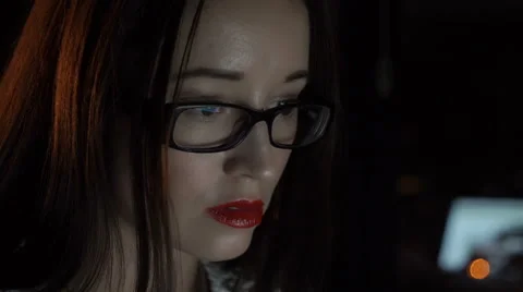 A woman working at a computer Видео 68432419