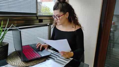 Woman is Working at the Computer at Home 2 Video stock 144446344