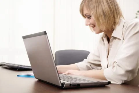 Woman working with computer Stock Photos