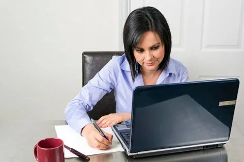 Woman working on the computer Stock Photos
