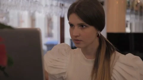 Woman working on computer, thinking, looking at display Stock Footage 133898361