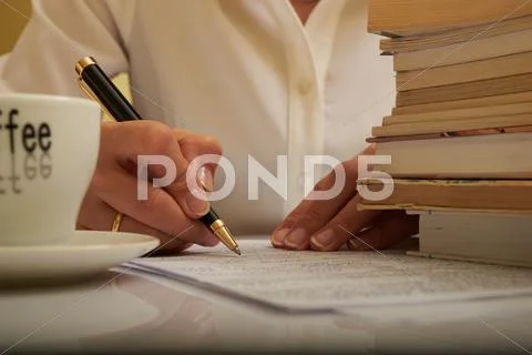 Woman working with documents and books Stock Photos