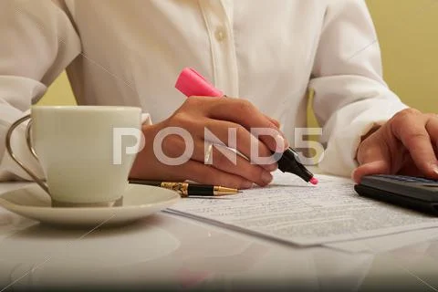 Woman working with documents on the table Stock Photos
