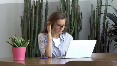 Woman working on her computer Stock Footage 87676192