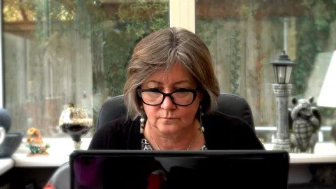 Woman working at a laptop computer Video stock 88240397