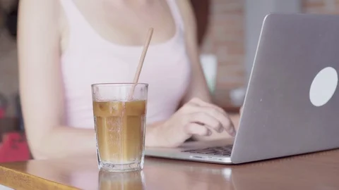 Woman working on a laptop computer while coffee break Stock Footage 92507360
