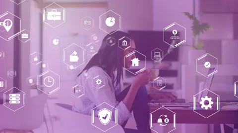 Woman working at laptop hexagonal tech icons appearing and overlaying while Stock Footage 334693955