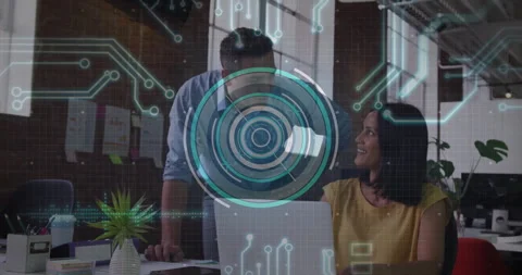 Woman working on laptop when man walks up behind her, collaborating while Stock Footage 311505553