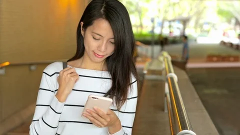 Woman working on mobile phone at outdoor Stock Footage