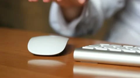 Woman working with mouse Stock Footage 10840294