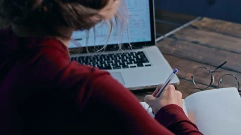 Woman working with the notebook at the table Stock Footage 166429692