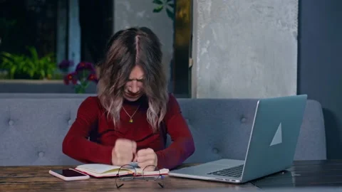 Woman working with the notebook at the table Stock Footage 166716237