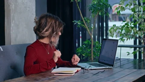 Woman working with the notebook at the table Stock Footage 166716295