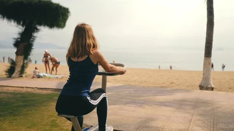 Woman is working out on the simulator. Stock Footage 119065729