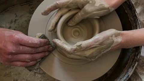 A woman working on a potter's wheel in a ceramic workshop Stock-Footage 196286341