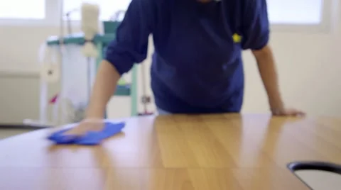 Woman working, professional maid cleaning and wiping table in office Stock Footage