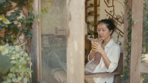 A Woman Working Remotely in a Comfortable and Cozy Indoor Space with a Relaxing Stock Footage 280848512