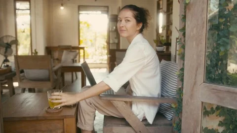 A Woman Working Remotely in a Comfortable and Cozy Indoor Space with a Relaxing Stock Footage 280848540