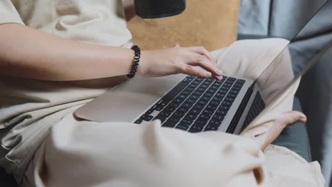 Woman working remotely from home, using laptop computer for online communication Stock Footage 334460708