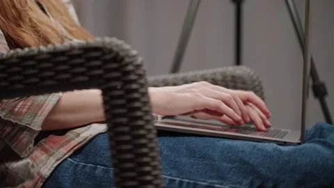 Woman working remotely, using AI tools, typing prompt using laptop. Stock Footage 281578635