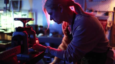 Woman working with rolling mill machine in a jewelry workshop Stock Footage 328086870