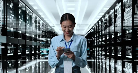 Woman Working In Server Room Database. Smiling And Shaking Head While Stock Footage 248005031