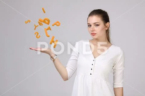 Woman working with a set of letters, writing concept Stock Photos