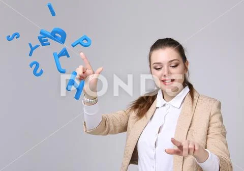 Woman working with a set of letters, writing concept Stock Photos