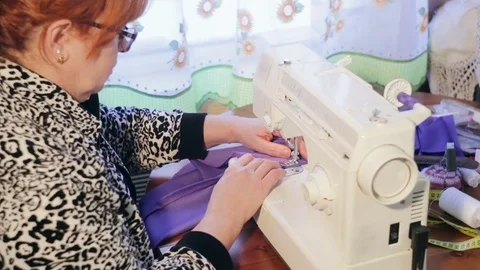 Woman working with sewing machine. Video stock 73045197