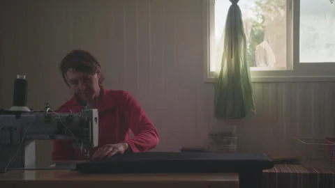 Woman working at sewing machine Stock Footage 275080579