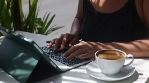Woman working on tab computer in cafe Stock Footage 265988377