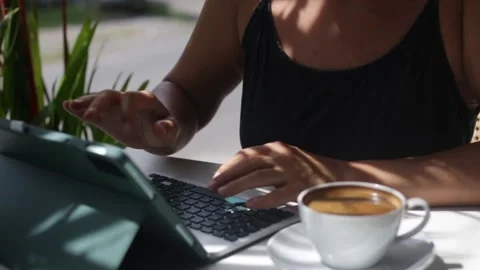 Woman working on tablet computer in cafe Stock Footage 265988136