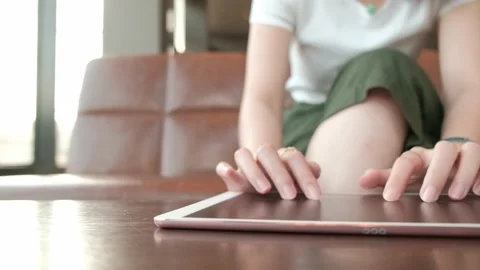Woman working on tablet computer in coffee shop. Stock Footage 135072958