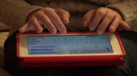Woman working with a tablet computer, typing a message, email Stock Footage 34651033