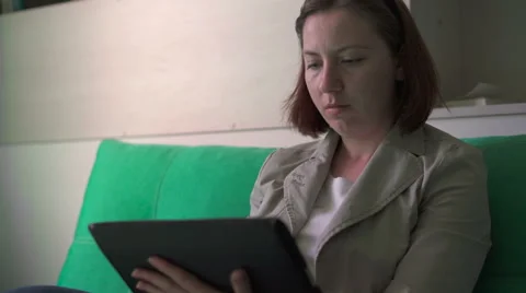 Woman working on a tablet Stock Footage 64391437
